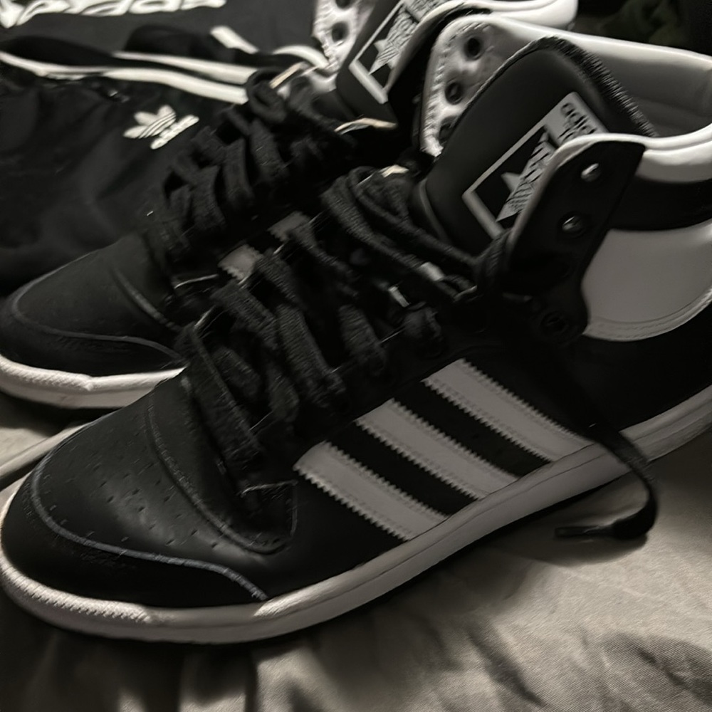 Brand new pair of size 10 1/2 Adidas sneakers black